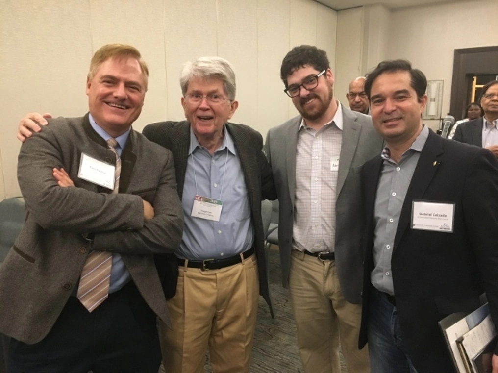 A group of men posses for a photo at an Atlas Network event.