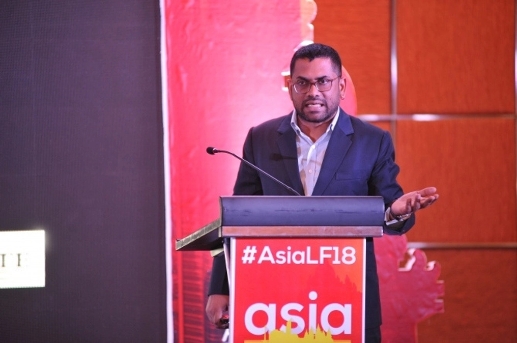 Rangaraju on stage speaking at the 2018 Asia Liberty Forum.
