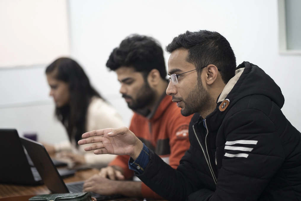Zubair leads a meeting of his staff at the AddtoGoogle office in Nehru Place (AtlasNetwork.org Photo/Bernat Parera).