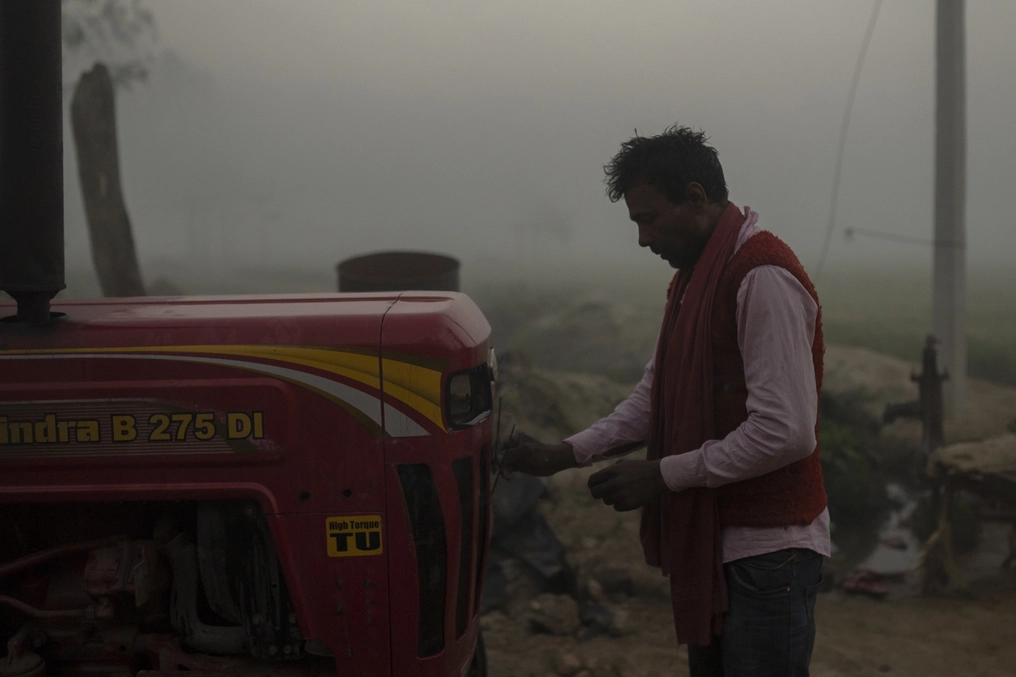 Making offerings to machines is a sign of respect to the deity Biswakarma (the Hindu architect god) in this part of Nepal. Lorik burns incense near his tractor early in the morning before he begins work. (AtlasNetwork.org Photo / Bernat Parera)