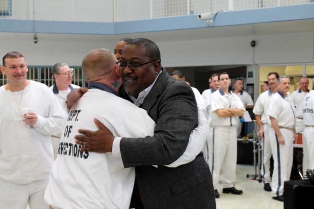 Former inmate Tony Kitchens celebrates 30 years of successful reintegration with residents of Walker Faith and Character-based Prison in Rock Spring, GA.