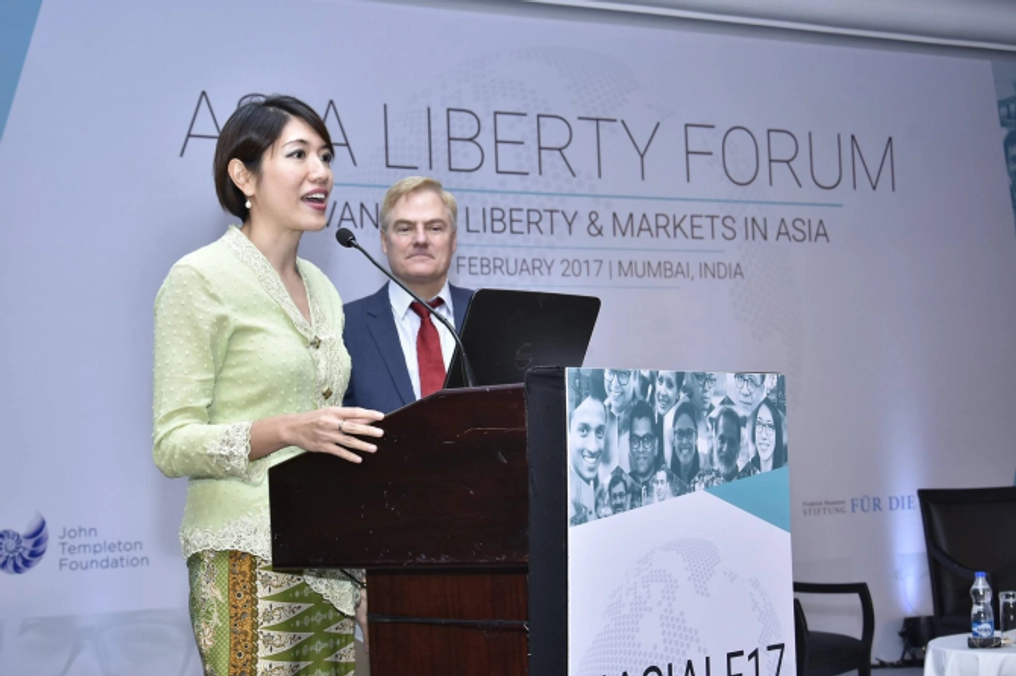 A woman delivers a speech at the Asia Liberty Forum.