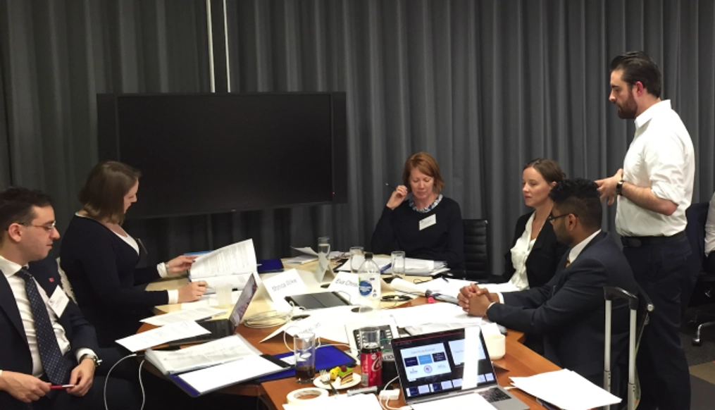 Monica Wilkie opposite Vale Sloane at a conference table.