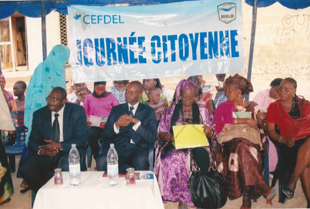 A group watches at an event in Senegal.