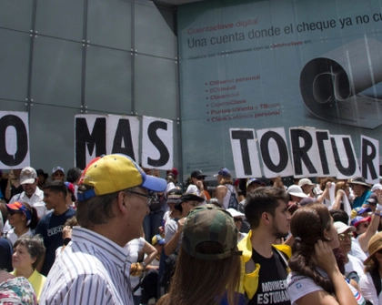 Photo Caption: Caracas, Venezuela | July 5, 2019: Venezuelans gather to protest against Nicolás Maduro's government repression, torture, and civil human rights violations. Credit: Edgloris Marys / Shutterstock.